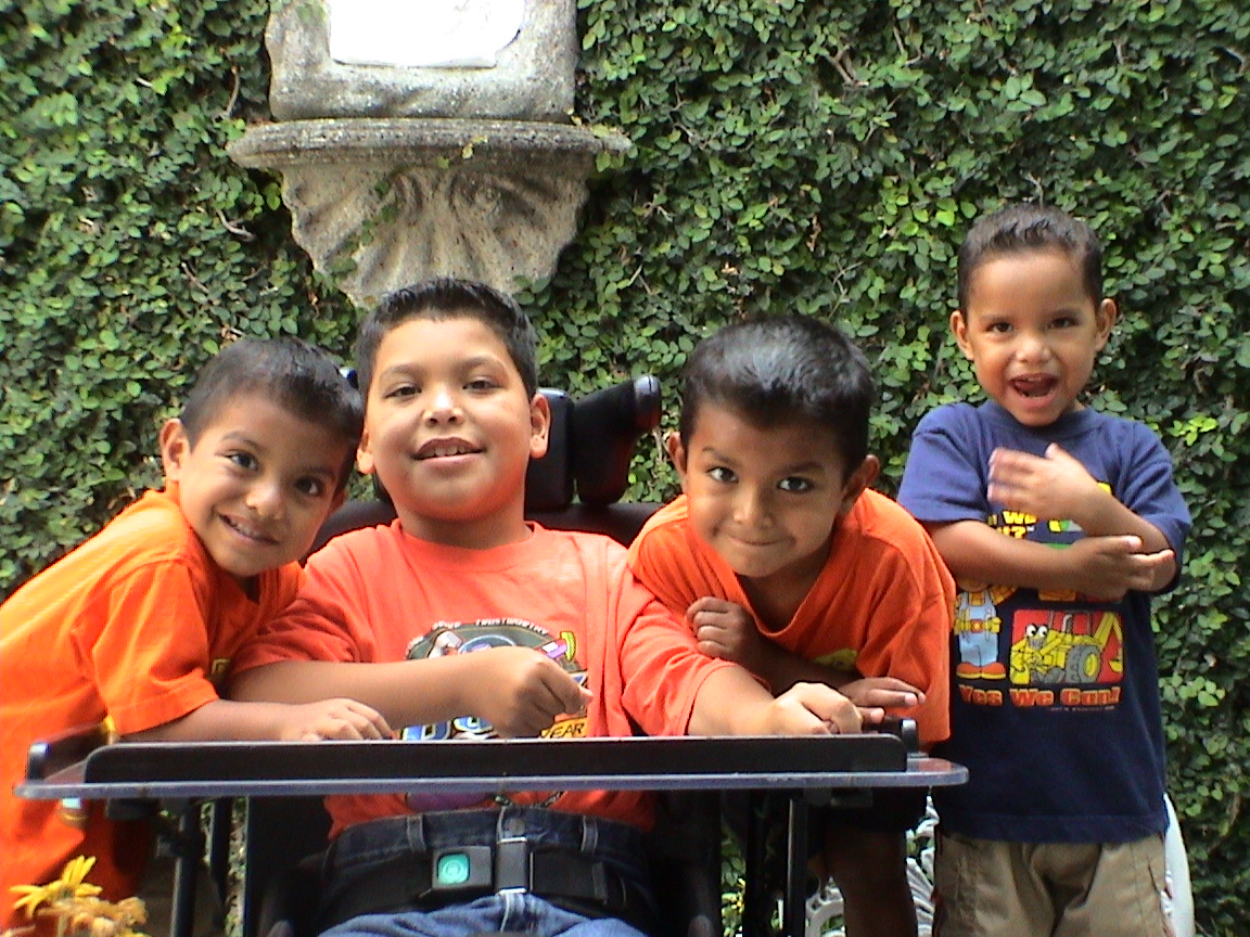 Raul as a child with his three brothers