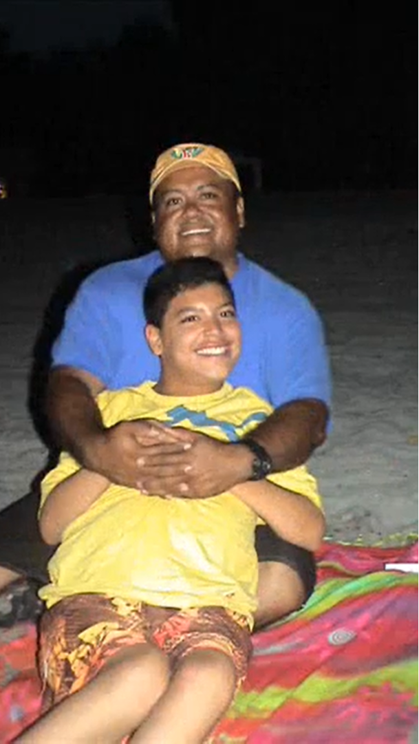 Raul as a teenager with his dad Raul on the beach at night